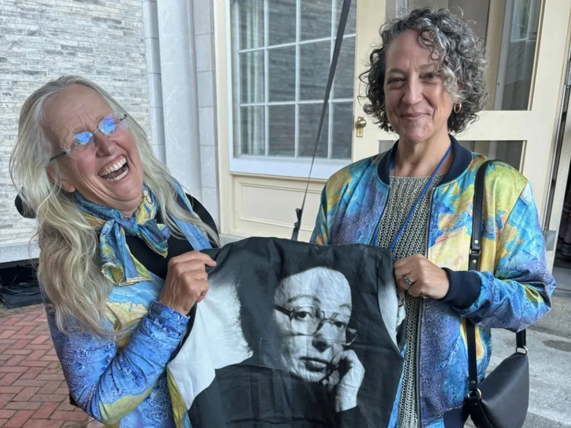 Robin Bell and Vicki Ferrini show off their Marie Tharp map clothing and jacket at the National Women’s Hall of Fame. Credit: Vicki Ferrini